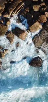 Aerial view of ocean waves crashing against rocky coastline.