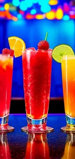 Vibrant mobile wallpaper with colorful cocktails against a blue background.