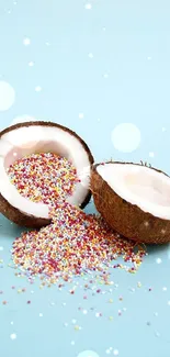 Coconut halves with colorful sprinkles on a light blue background.