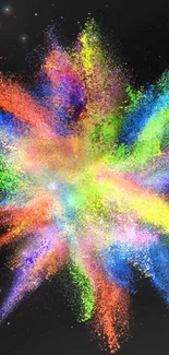 Vibrant explosion of colorful powder on a black background.