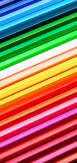 Colorful diagonal lines of red, blue, and green pencils on a white background.