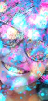 Smiling face with vibrant pink and blue powder, wearing sunglasses.