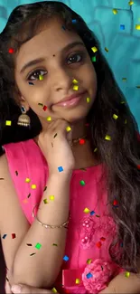 Girl with long hair in pink dress surrounded by confetti on blue backdrop.