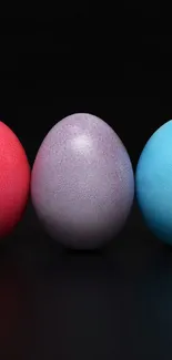 Vibrant wallpaper with colorful eggs on black background.