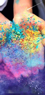 Colorful hands with Holi powder paint in vibrant shades.