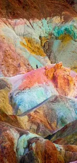 Colorful rocky landscape with vibrant pink, orange, and green hues.