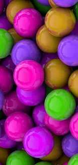 Vibrant colorful wallpaper with glossy spheres in pink, green, and purple hues.