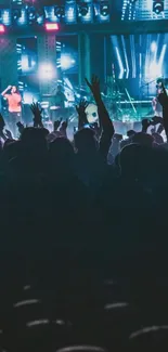 Energetic crowd enjoying a live concert with blue stage lighting.