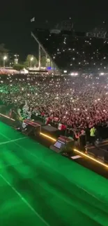 Vibrant concert night scene with lights and crowd.