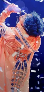 A dynamic performer in vibrant costume on stage with confetti falling.