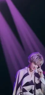 Live concert wallpaper with purple lighting and stage presence.