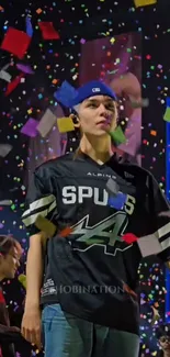 Person standing amid colorful confetti.