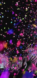 Vibrant confetti explosion against dark background on mobile wallpaper.