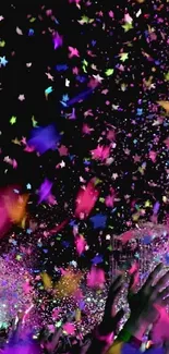 Vibrant confetti bursts against a dark backdrop at a lively celebration.