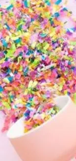 Vibrant confetti spilling from a pink cup.