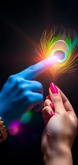 Artistic image of fingers touching with a colorful light burst on a dark background.