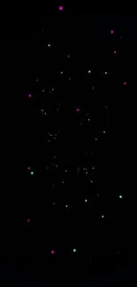 Vibrant cosmic dots, pink and turquoise, on black background wallpaper.