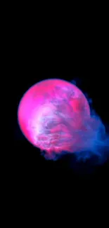 Vibrant cosmic orb with pink and blue hues on a black background.