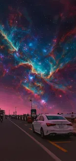 Cosmic roadscape with colorful nebula sky above a city street.