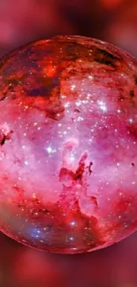 Vibrant cosmic sphere with red and pink hues on a space-themed wallpaper.