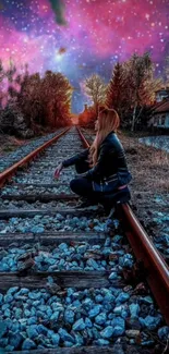 Girl sits on train tracks under a vibrant starlit pink and purple sky.