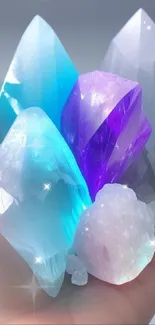 Hand holding vibrant blue and purple crystals.