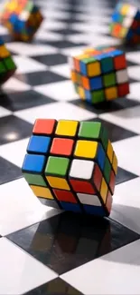 Colorful Rubik's cubes on a checkered floor.