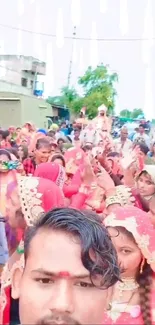 Crowd enjoying a vibrant cultural celebration in colorful traditional attire.