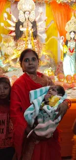 Family in traditional attire at a vibrant cultural festival with colorful decor.