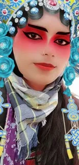 Vibrant cultural portrait with blue headdress and red makeup.