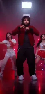 Vibrant dance scene with red and black hues on stage.