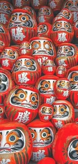 Vibrant pile of red Daruma dolls in Japanese style design.