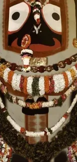 Colorful deity with floral garlands.