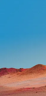 Vibrant desert with red dunes under a blue sky wallpaper.