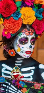 Colorful Dia de los Muertos face paint with vibrant flower crown.