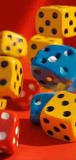 Colorful dice on red background wallpaper.
