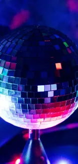 Disco ball with vibrant lights and colorful reflections.