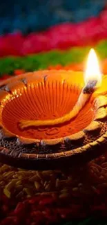 Glowing diya on a colorful background, perfect for festive wallpaper.