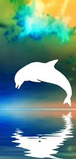 Jumping dolphin silhouette on colorful sky background.