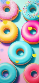 Vibrant wallpaper with colorful donuts on an aqua and pink background.