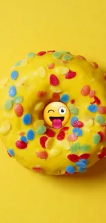 Bright yellow donut wallpaper with colorful sprinkles and an emoji.