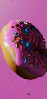 A vibrant donut with sprinkles on a pink background.