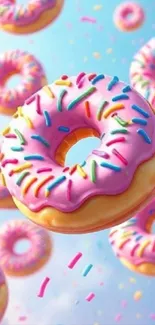 Colorful donuts with sprinkles on a blue sky background.