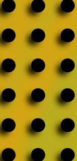 Yellow wallpaper with black dots in a gradient pattern.