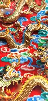 Vibrant golden dragons and clouds on a red background wallpaper.