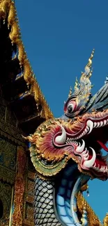 Intricate dragon sculpture with vibrant colors on a temple background.