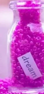 Pink beads in a bottle with dream tag.