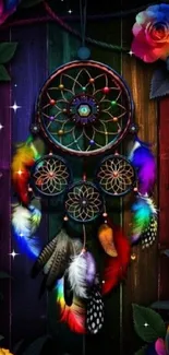 Vibrant dream catcher with colorful feathers and roses on dark wooden background.