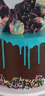 Vibrant chocolate drip cake with colorful icing and sprinkles.