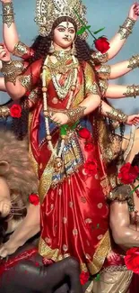 Colorful image of Goddess Durga with a lion and ornate decorations.